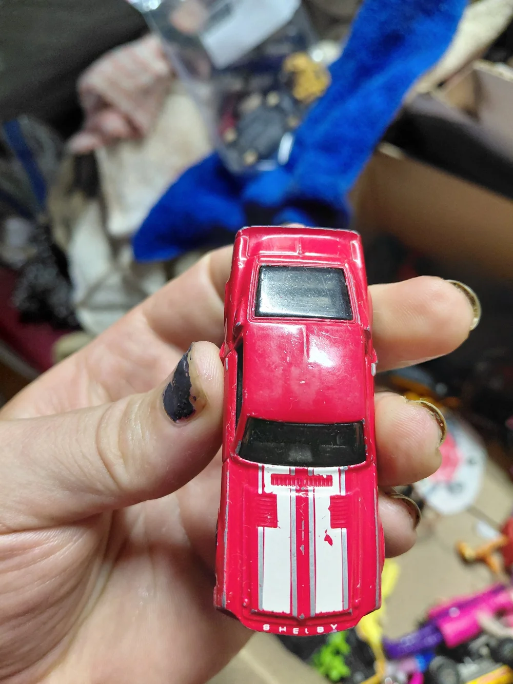 red 1968 Shelby GT500 diecast car by Hot Wheels